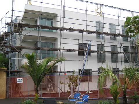 Scaffolding around the side of cutters cove apartment building managed by IPMS