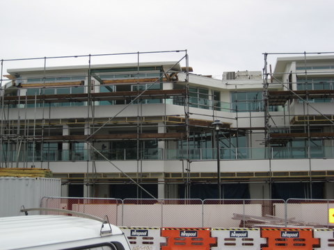 scaffolding surrounding cutters cove apartment