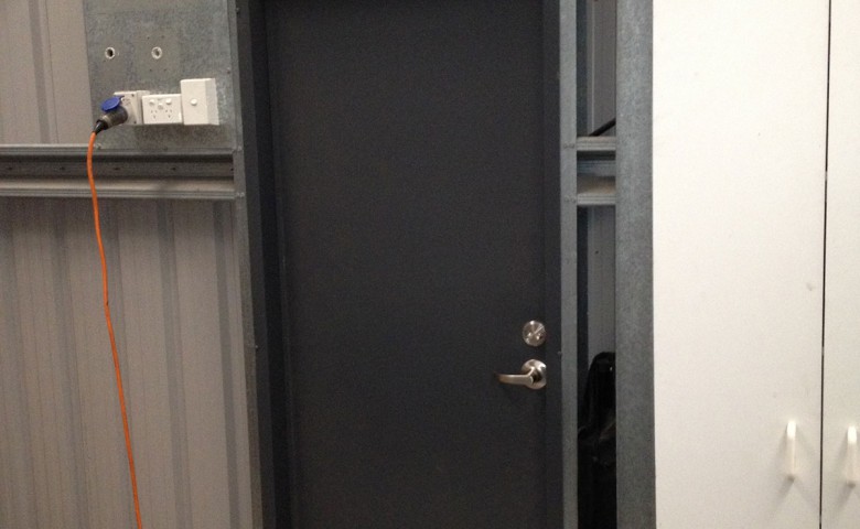 black door on new engineering workshop at McFall Museum